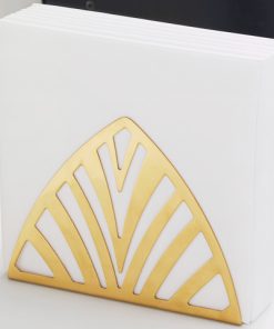 Gold napkin holder containing napkins