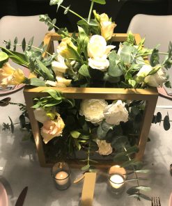 Gold metal cube with white roses