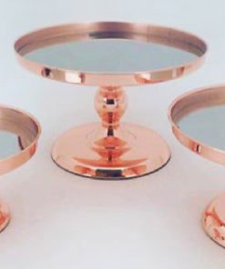 Three rose gold cake stands with mirrored bases