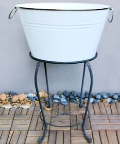 White bucket on iron stand in courtyard