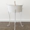 White bucket on white iron stand