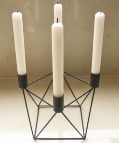 Black candle holder with 4 white tapered candles