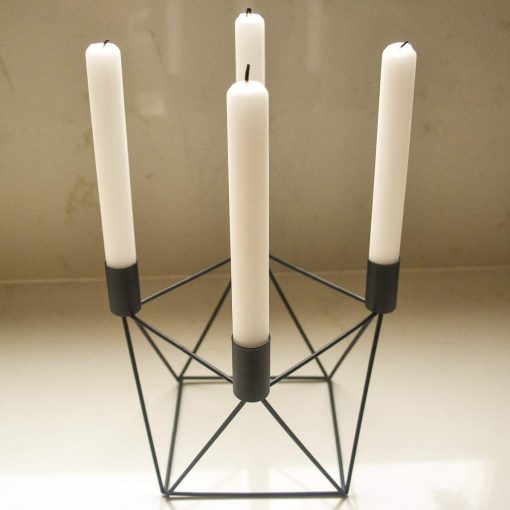 Black candle holder with 4 white tapered candles