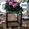 Black cube centerpieces with floral arrangement