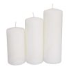 Group of three white pillar candles