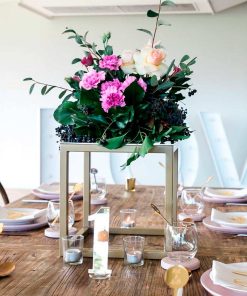 Gold metal table cube used to display flowers