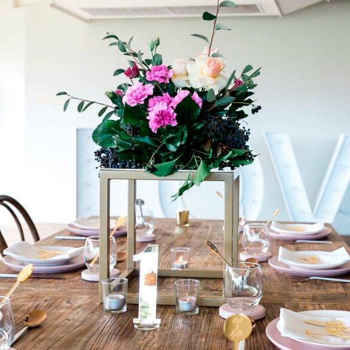 Gold metal table cube used to display flowers