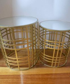 Two gold metal tables with glass tops