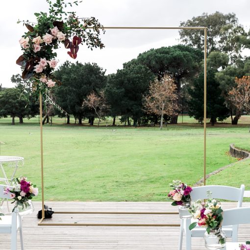 Square golden arch with floral arrangement