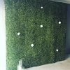 Large green wall with floral attachements