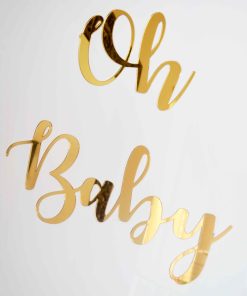 Gold mirrored glass letters that say Oh Baby