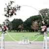 Circular white arch with floral arrangements