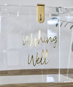 Clear box with gold text saying wishing well