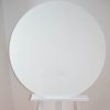 Large white circular board on white easel