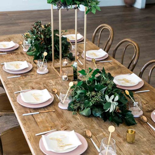 Modern wedding reception gold table setting