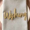 Gold wording saying 'Wishing'