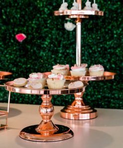 Rose gold metal cake stands with cupcakes and biscuits