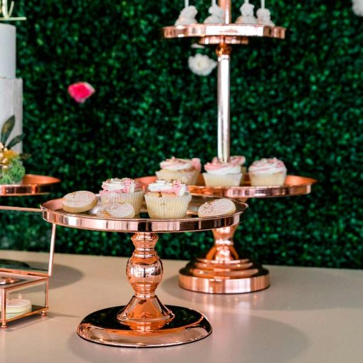 Rose gold metal cake stands with cupcakes and biscuits