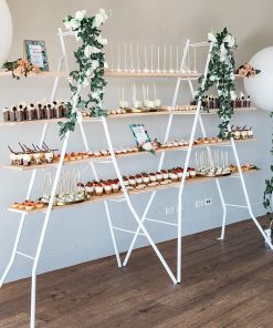 Tiered dessert shelving stand adorned with different dessert offerings