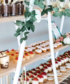 Close up of desserts displayed on shelving stand