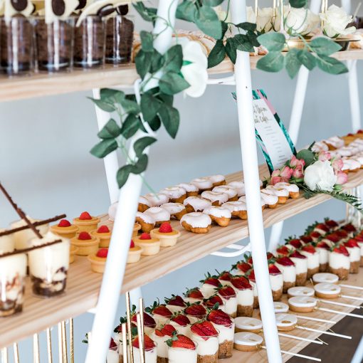 Close up of desserts displayed on shelving stand