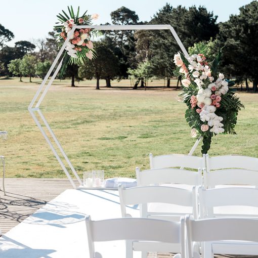 Hexagon 3D arch adorned with flowers in park