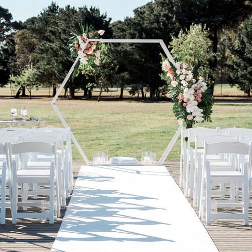 White hexagon 3D arch with floral attachments for park wedding