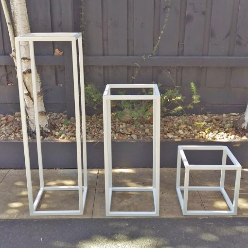 White tall metal stands