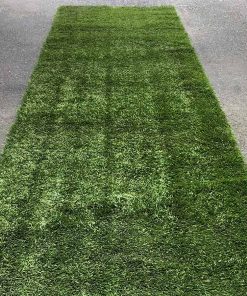 Green artificial turf aisle runner being used outdoors