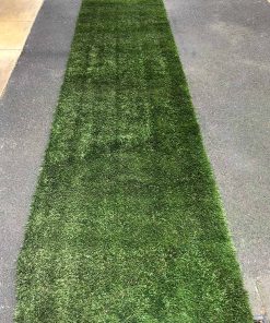 Strip of green turf being used as aisle runner