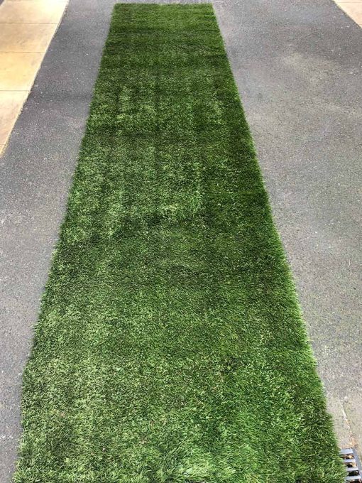 Strip of green turf being used as aisle runner