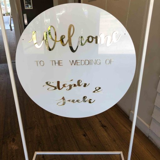 800 Diameter white board & gold acrylic writing "welcome to the wedding of Steph and Jack"