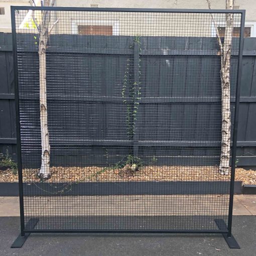 Black metal frame 2.3m square with mesh screen in middle standing in driveway