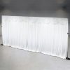 Large white curtain backdrop with swag