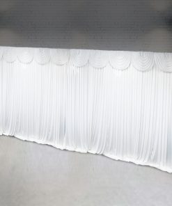 Large white curtain backdrop with swag