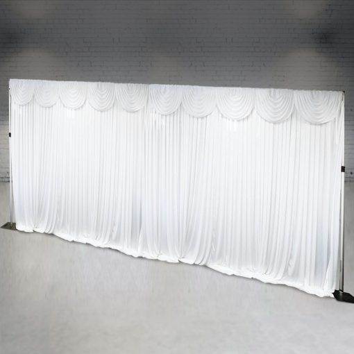 Large white curtain backdrop with swag