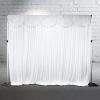 White silk curtain with scalloped sash at top